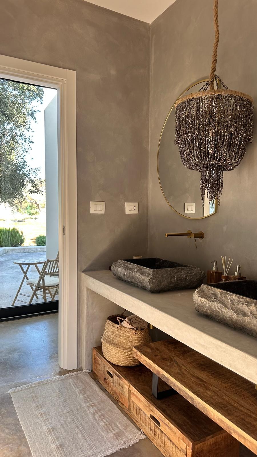 Bathroom door open to the olive grove