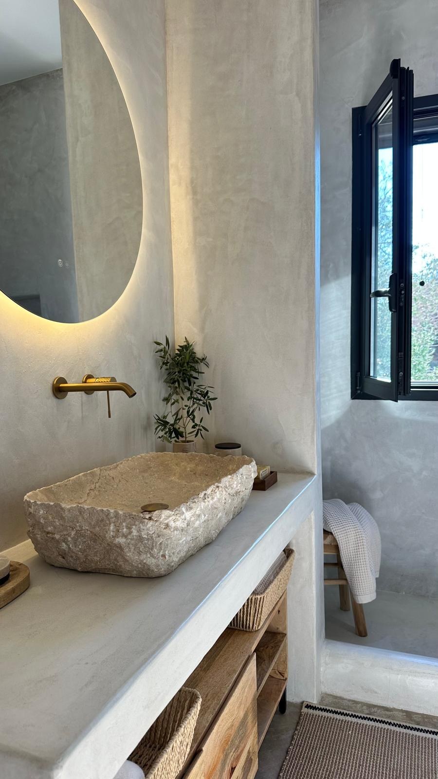 Travertine vanity with backlit mirror