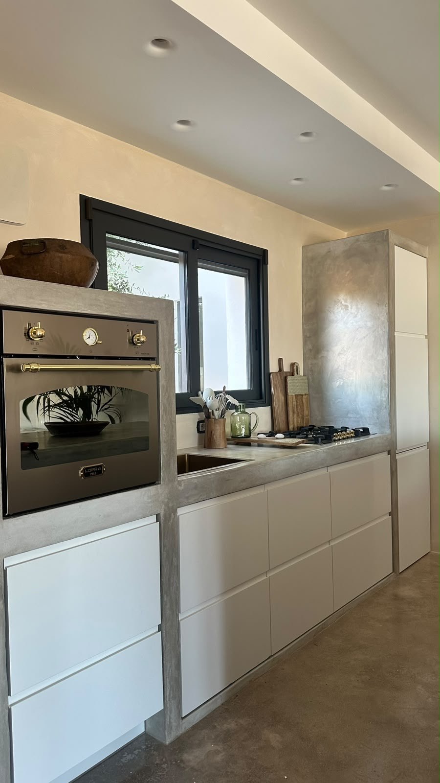 Country oven set into the microplaster kitchen